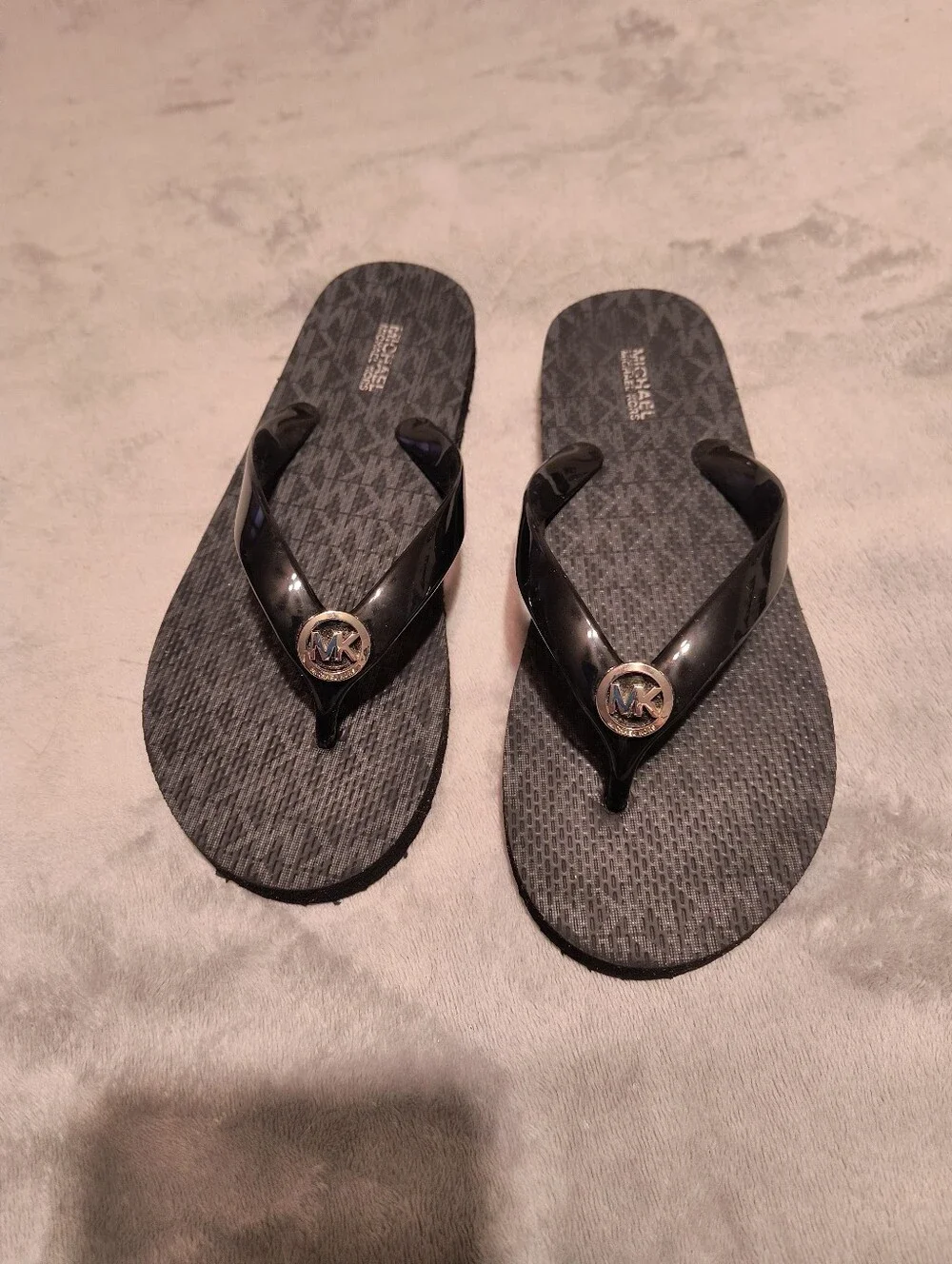 MK black flip flops size 7